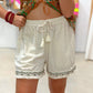 Short Lino Detalles